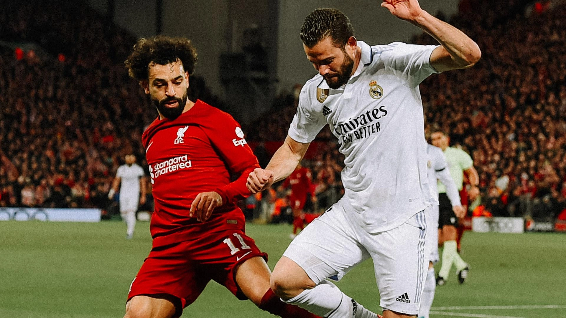 Mohamed Salah berduel dengan pemain Real Madrid di Liga Champions. (Foto/liverpoolfc.com)
