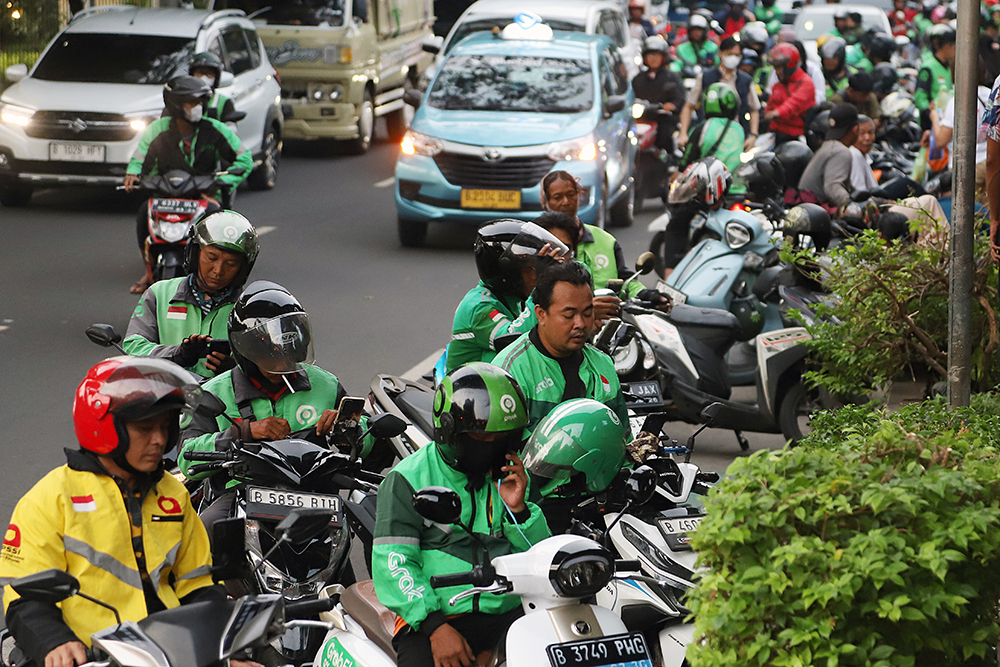1,7Juta Pengemudi Ojol Belum Terlindungi BPJS Ketenagakerjaan Aktivitas pengemudi ojek online di kawasan Jakarta. (BeritaNasional/Elvis Sendouw)