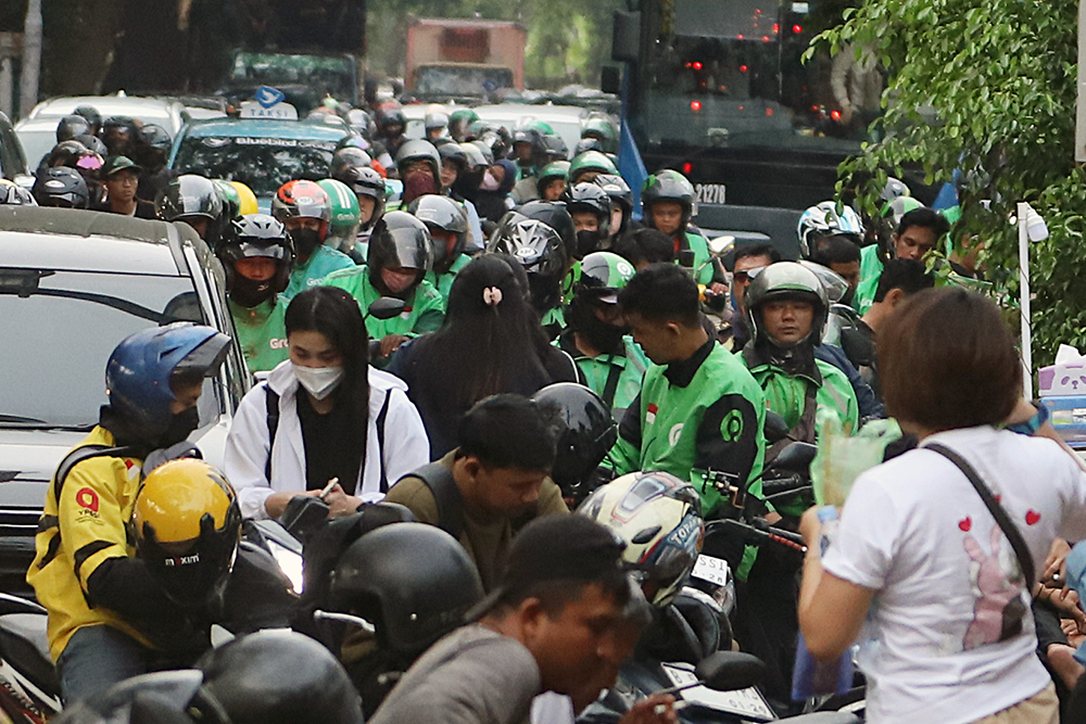 1,7Juta Pengemudi Ojol Belum Terlindungi BPJS Ketenagakerjaan Aktivitas pengemudi ojek online di kawasan Jakarta. (BeritaNasional/Elvis Sendouw)