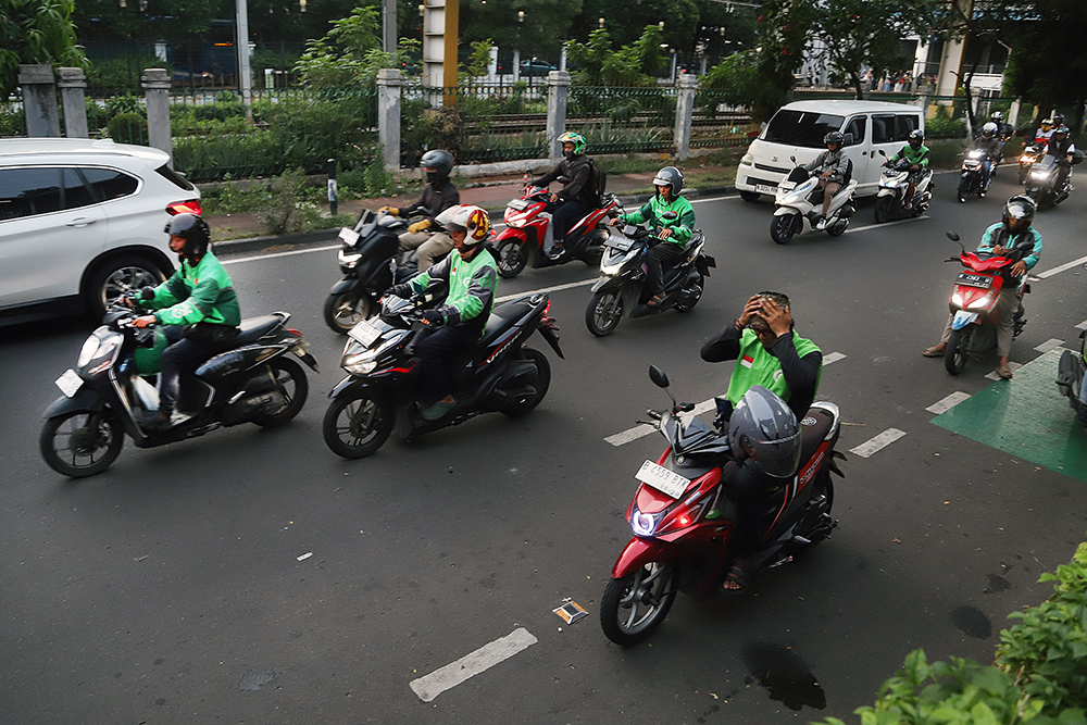 1,7Juta Pengemudi Ojol Belum Terlindungi BPJS Ketenagakerjaan Aktivitas pengemudi ojek online di kawasan Jakarta. (BeritaNasional/Elvis Sendouw)