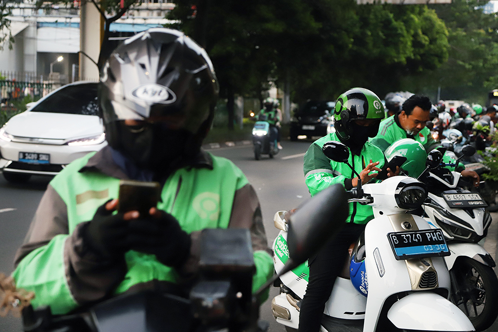 1,7Juta Pengemudi Ojol Belum Terlindungi BPJS Ketenagakerjaan Aktivitas pengemudi ojek online di kawasan Jakarta. (BeritaNasional/Elvis Sendouw)