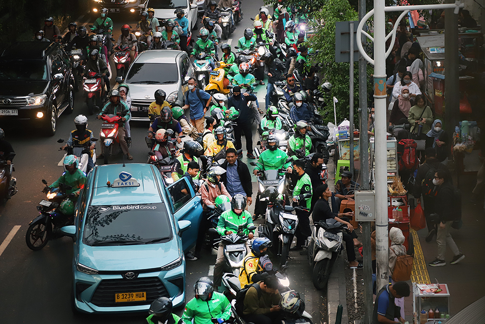 1,7Juta Pengemudi Ojol Belum Terlindungi BPJS Ketenagakerjaan Aktivitas pengemudi ojek online di kawasan Jakarta. (BeritaNasional/Elvis Sendouw)