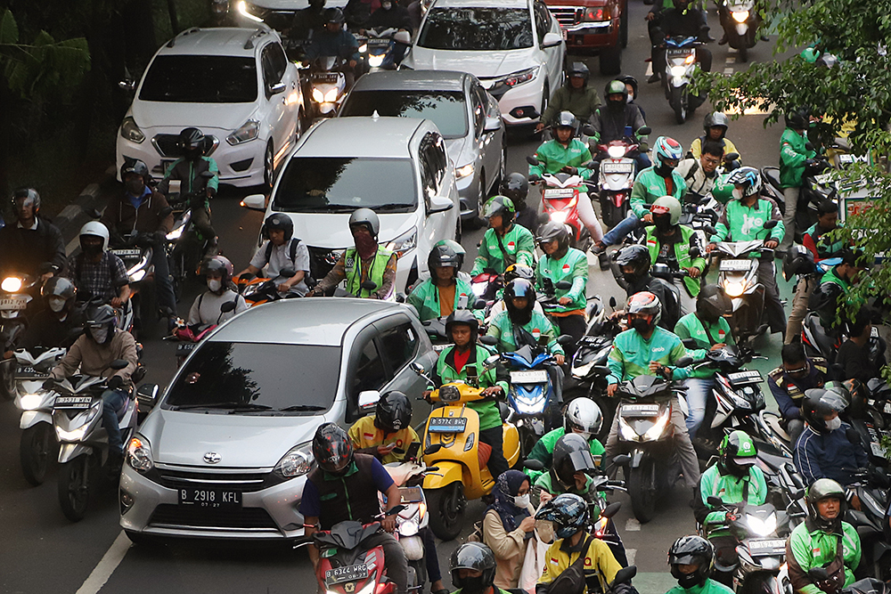 1,7Juta Pengemudi Ojol Belum Terlindungi BPJS Ketenagakerjaan Aktivitas pengemudi ojek online di kawasan Jakarta. (BeritaNasional/Elvis Sendouw)